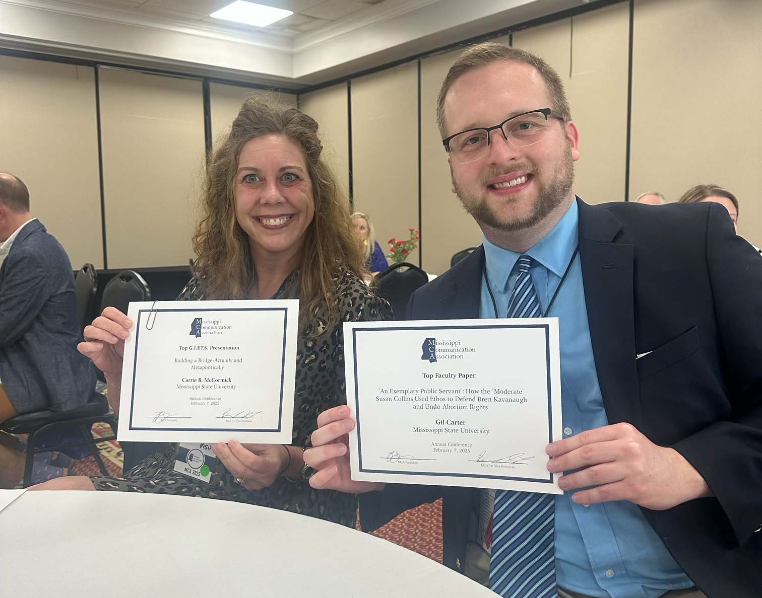 Carrie McCormick and Gil Carter show off awards from MCA conference